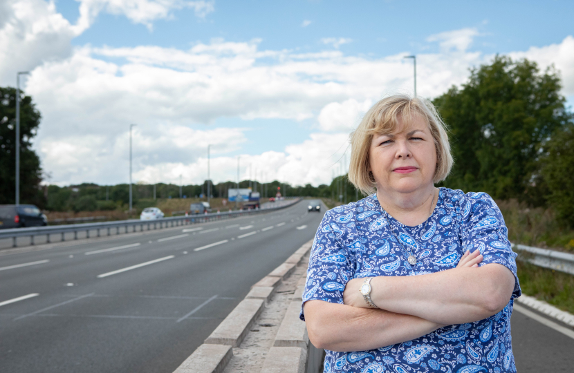 Jane standing next to the A512