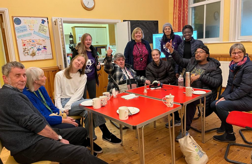 Jane with others at the Welcome Hub