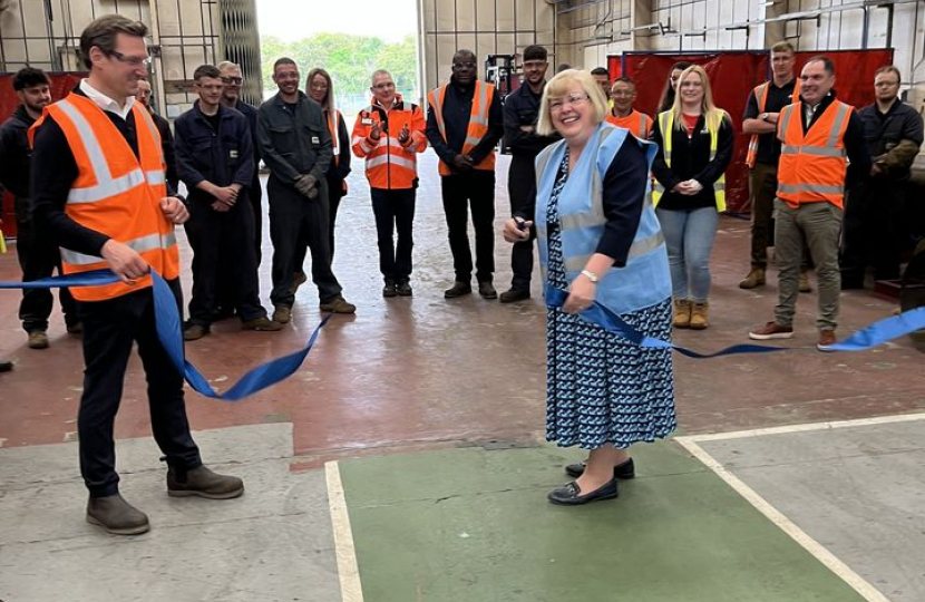 Jane cutting the ribbon in the new building