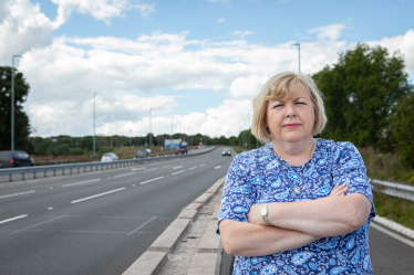 Jane standing next to the A512