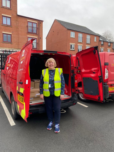 Jane with a Royal Mail van.