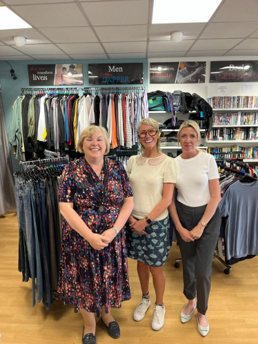 Jane and one of her caseworkers at the shop