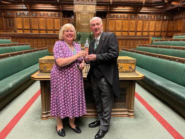 Jane and the Speaker holding a model of the Carillon