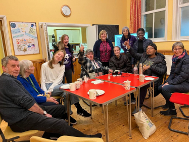 Jane with others at the Welcome Hub