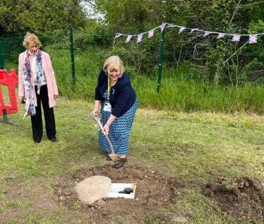 Jane burying the Coronation Time Capsule